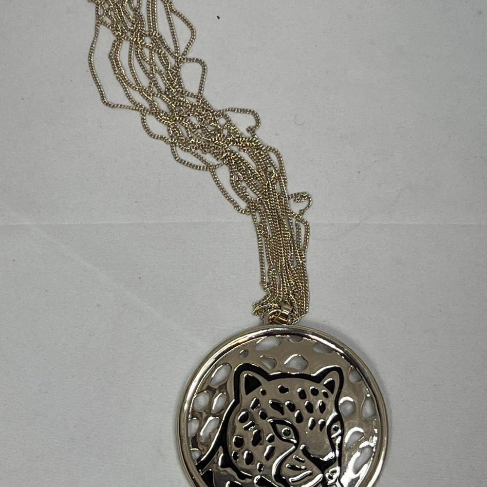Ballet gold toned necklace with giant leopard pendant.